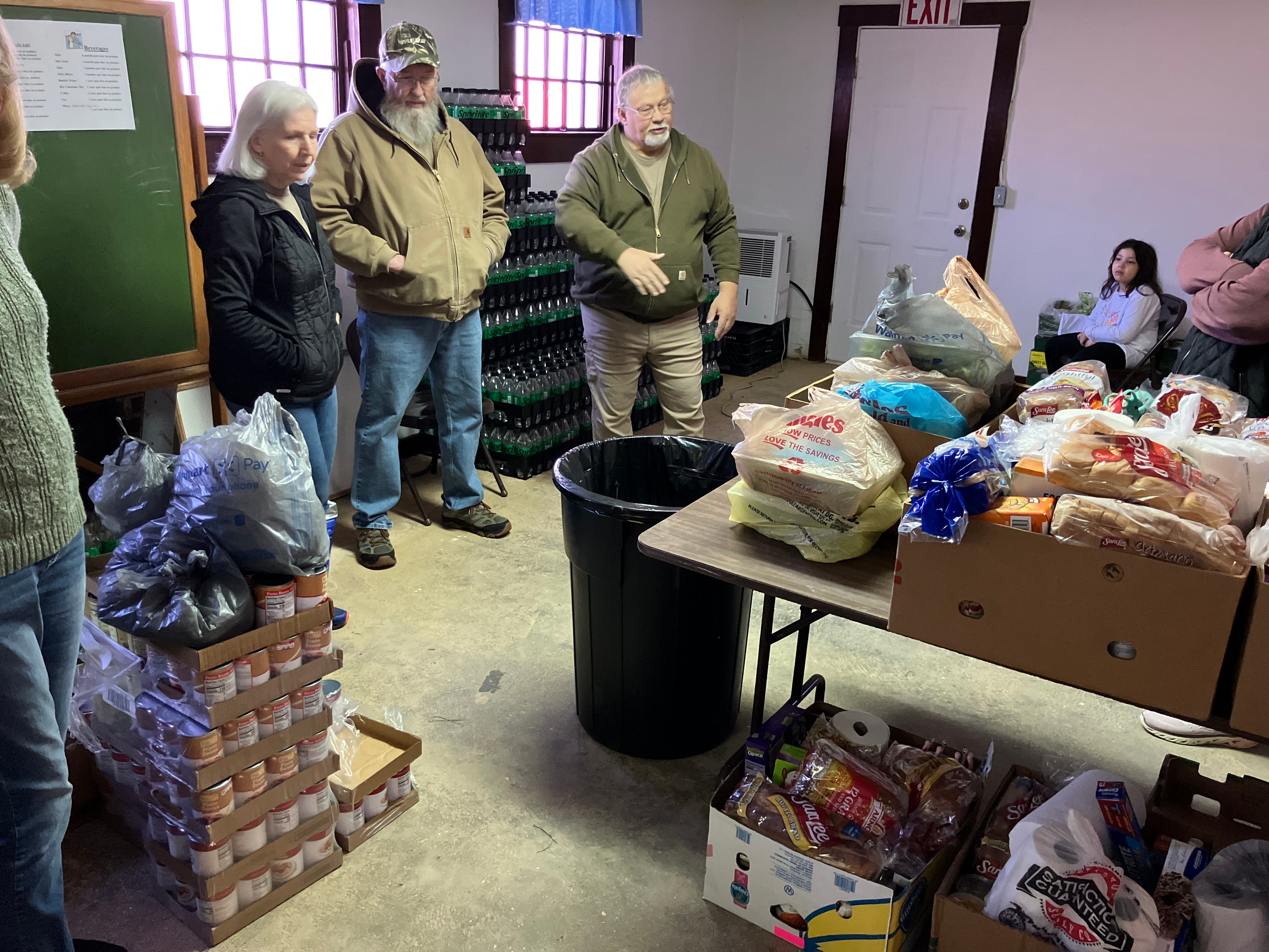 Volunteers serving meals at community kitchen